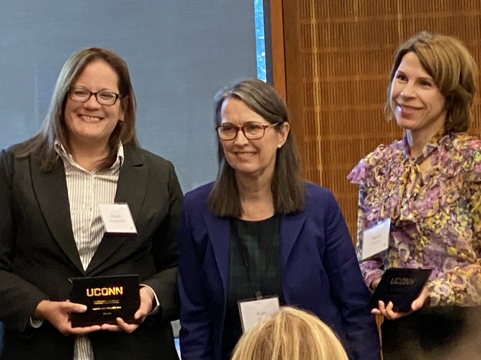Angela accepting the award from the provost
