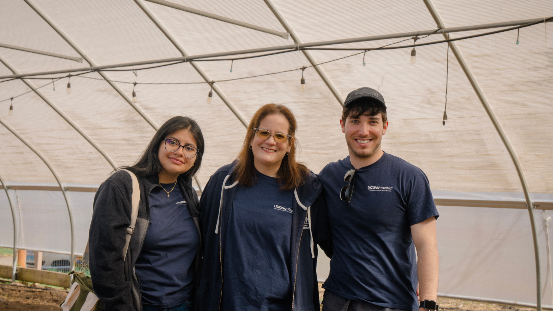 Angela Bermudez, Michael Raizin, and Lisbeth Moran with the greenhouse at Keney Park