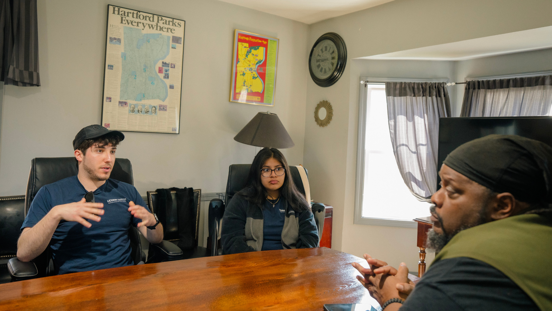 Angela Bermudez, Michael Raizin, and Lisbeth Moran speaking with Herb at Keney Park
